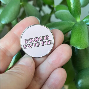Brand new Taylor Swift “Proud Swiftie” pink enamel pin